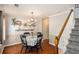 Formal dining room with decorative shelves and stairs leading to the upper level at 36 Pooles Bend Ct, Hiram, GA 30141