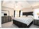 Spacious main bedroom with a large bed, dark wood furniture, tray ceiling, and an ensuite bathroom at 36 Pooles Bend Ct, Hiram, GA 30141