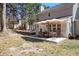 Outdoor patio seating and umbrella provides an entertainment space in the backyard at 36 Pooles Bend Ct, Hiram, GA 30141