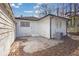 Back of home features an AC unit, white painted brick, and a concrete patio at 556 Holly Nw St, Atlanta, GA 30318