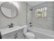Updated bathroom features modern fixtures and stylish tile work around the tub at 556 Holly Nw St, Atlanta, GA 30318