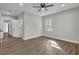 Bright bedroom has wood-look floors, a ceiling fan, and a window at 556 Holly Nw St, Atlanta, GA 30318