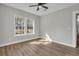 Bedroom with a ceiling fan, laminate flooring, and natural light at 556 Holly Nw St, Atlanta, GA 30318