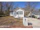Quaint home with a white brick mailbox and a charming carport at 556 Holly Nw St, Atlanta, GA 30318