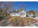 Charming bungalow with a painted brick facade and a detached garage at 556 Holly Nw St, Atlanta, GA 30318