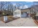 Charming white brick home with a covered carport and well-maintained landscaping at 556 Holly Nw St, Atlanta, GA 30318