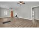 Spacious living room features new hardwood floors, fireplace, and a wooden front door at 556 Holly Nw St, Atlanta, GA 30318