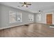 Bright and airy living room with hardwood floors, a fireplace and multiple windows at 556 Holly Nw St, Atlanta, GA 30318