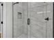 Modern shower features glass door, rainfall shower head, and tiled walls at 556 Holly Nw St, Atlanta, GA 30318