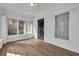 Bright sunroom features wood flooring, white painted brick and lots of natural light at 556 Holly Nw St, Atlanta, GA 30318