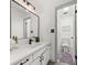 Bright bathroom with a modern vanity, updated fixtures, and convenient access to the shower at 7256 Attache Way, Riverdale, GA 30296
