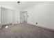 This bright bedroom has neutral carpet, base trim, and paint to fit any decor at 7256 Attache Way, Riverdale, GA 30296