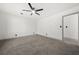 Bedroom with neutral paint, trim, plush carpet, and ceiling fan at 7256 Attache Way, Riverdale, GA 30296