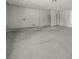 View of the garage with neutral paint and floor at 7256 Attache Way, Riverdale, GA 30296