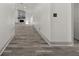 Spacious living room with wood-look floors and a cozy fireplace as a focal point at 7256 Attache Way, Riverdale, GA 30296