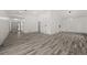 Expansive living area with wood-look flooring and plenty of natural light at 7256 Attache Way, Riverdale, GA 30296