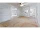 View of the open floor plan into adjacent rooms, awaiting your personal touches at 9132 Brewer Rd, Villa Rica, GA 30180
