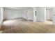 Open living room with view of the adjacent rooms, and natural light at 9132 Brewer Rd, Villa Rica, GA 30180