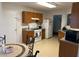 Cozy kitchen with white appliances, a window, and wood cabinets at 1195 Se Stony Pt, Grayson, GA 30017