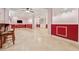 Finished basement with decorative molding, a bar, tile floor and a TV at 3620 Highpoint Rd, Cumming, GA 30041