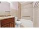 Neutral bathroom with tile, tub, toilet, and granite sink at 3620 Highpoint Rd, Cumming, GA 30041