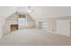 Attic Bonus room features white walls, built-in shelving, carpet flooring, and a window for natural light at 3620 Highpoint Rd, Cumming, GA 30041