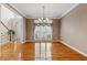Elegant dining room with hardwood floors and chandelier lighting perfect for entertaining guests at 3620 Highpoint Rd, Cumming, GA 30041