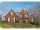 Attractive two-story brick home with black shutters and large front yard at 3620 Highpoint Rd, Cumming, GA 30041