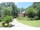 Beautiful two-story brick home with well-manicured lawn and inviting driveway at 3620 Highpoint Rd, Cumming, GA 30041