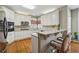 Bright kitchen featuring stainless appliances, granite countertops and eat-in bar at 3620 Highpoint Rd, Cumming, GA 30041