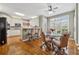 Eat-in kitchen featuring hardwood floors, a glass table, and modern stainless-steel appliances at 3620 Highpoint Rd, Cumming, GA 30041