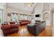 Inviting living room with fireplace, built-in shelving, and ample seating for entertaining at 3620 Highpoint Rd, Cumming, GA 30041