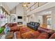 Cozy living room featuring fireplace, built-ins and comfortable seating with view of second story at 3620 Highpoint Rd, Cumming, GA 30041