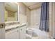 Bathroom featuring a tub-shower combo with a tiled surround and a vanity with a granite countertop at 5029 Tarry Glen Dr, Suwanee, GA 30024