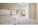 Charming bedroom featuring a cozy white bed, a desk and chair, and playful decor at 5029 Tarry Glen Dr, Suwanee, GA 30024