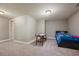 Neutral bedroom with carpet flooring, an air hockey table and minimalist bed frame at 5029 Tarry Glen Dr, Suwanee, GA 30024