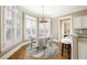 Breakfast nook with a round table, seating for four, hardwood floors, and bay windows at 5029 Tarry Glen Dr, Suwanee, GA 30024