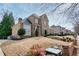 Traditional brick home featuring manicured landscaping, a bay window and a classic design at 5029 Tarry Glen Dr, Suwanee, GA 30024