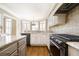 Spacious kitchen features stainless steel appliances, granite countertops, and a bay window at 5029 Tarry Glen Dr, Suwanee, GA 30024