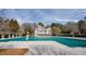 Community pool fully covered by a winter pool cover at 5029 Tarry Glen Dr, Suwanee, GA 30024