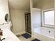 Bathroom featuring double sinks, soaking tub, a shower, and a neutral color palette at 207 Birchwood Dr, Loganville, GA 30052