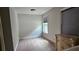 Small bedroom with carpet flooring, a window for natural light, and modern decor at 207 Birchwood Dr, Loganville, GA 30052