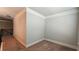 Upstairs carpeted area with white crown molding and neutral paint at 207 Birchwood Dr, Loganville, GA 30052