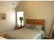 Bedroom with neutral carpet and walls, a bed, a lamp, and a window at 207 Birchwood Dr, Loganville, GA 30052