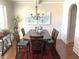 Traditional dining room with a wooden table, seating for six and stylish chandelier at 207 Birchwood Dr, Loganville, GA 30052