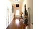 Charming hallway with hardwood floors and elegant decor at 207 Birchwood Dr, Loganville, GA 30052