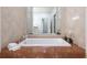 Elegant bathroom with marble accents, a soaking tub, and white towels at 2500 Peachtree Nw Rd # 605S, Atlanta, GA 30305