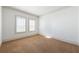 Empty bedroom with neutral walls, carpet, and bright windows at 2500 Peachtree Nw Rd # 605S, Atlanta, GA 30305