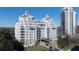 Beautiful building exterior with multiple balconies and covered entrance, surrounded by lush landscaping at 2500 Peachtree Nw Rd # 605S, Atlanta, GA 30305