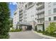 Luxury condo building with manicured landscaping and porte cochere for convenient access at 2500 Peachtree Nw Rd # 605S, Atlanta, GA 30305